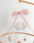 Mobile with a brown rocking horse and pink bow