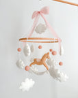 Mobile with a brown rocking horse and pink bow
