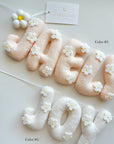 Name banner with daises