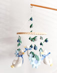Goose mobile with blue flowers