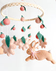 Rabbit mobile with pink flowers