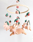 Rabbit mobile with pink flowers