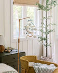 Mobile with a white rocking horse and a blue bow