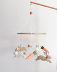 Minimalist bunny mobile with carrots