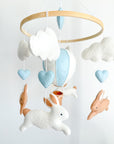 Brown bunny mobile with blue air ballon