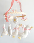 Pink mobile with goose