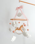 Mobile with a brown rocking horse and pink bow