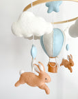 Brown bunny mobile with blue air ballon