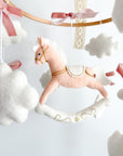 Mobile with a pink rocking horse