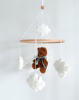 Boucle mobile with dark brown teddy bear