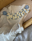 Name banner with blue flowers