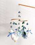 Goose mobile with blue flowers
