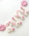 Name banner with pink flowers