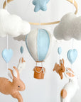 Brown bunny mobile with blue air ballon