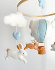 Brown bunny mobile with blue air ballon