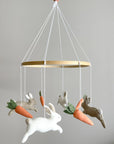 Minimalist bunny mobile with carrots