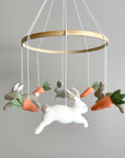 Minimalist bunny mobile with carrots