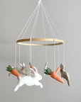 Minimalist bunny mobile with carrots