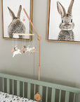 Minimalist bunny mobile with carrots