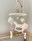White rocking horse mobile with gifts
