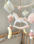 White rocking horse mobile with gifts