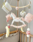 White rocking horse mobile with gifts