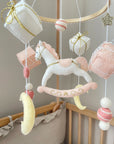 White rocking horse mobile with gifts