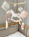 White rocking horse mobile with gifts