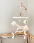 White rocking horse mobile with gifts