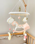 White rocking horse mobile with gifts