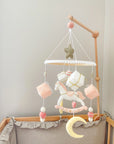 White rocking horse mobile with gifts