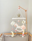 White rocking horse mobile with gifts
