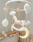 Pink rocking horse mobile with clouds