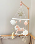 Pink rocking horse mobile with clouds