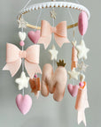 Light pink bow mobile with glitter details
