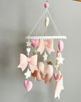 Light pink bow mobile with glitter details