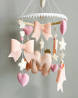 Light pink bow mobile with glitter details