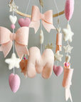 Light pink bow mobile with glitter details