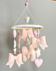 Mobile with light pink bows