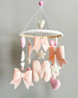 Mobile with light pink bows