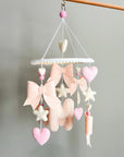 Mobile with light pink bows