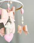 Mobile with light pink bows