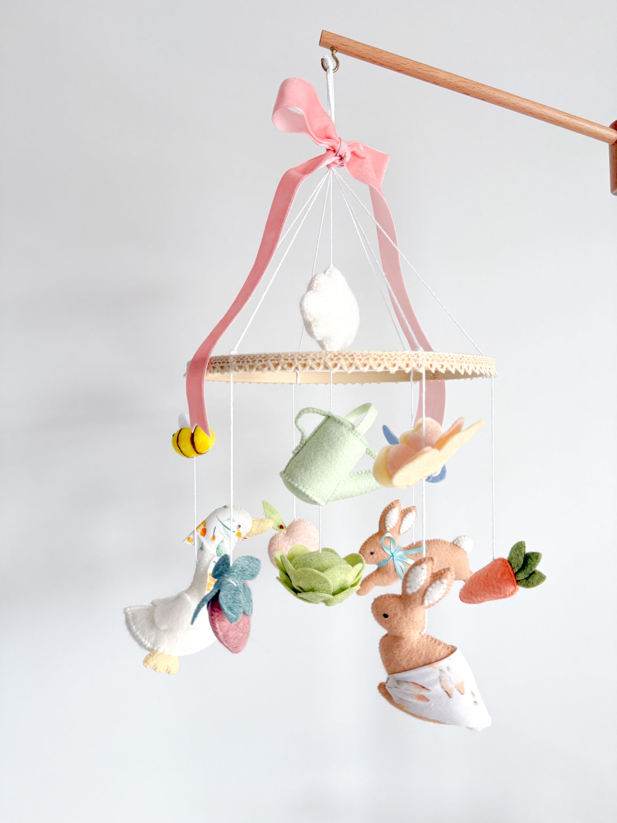 Garden rabbit mobile with pink bow