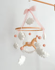 Mobile with a brown rocking horse and pink bow