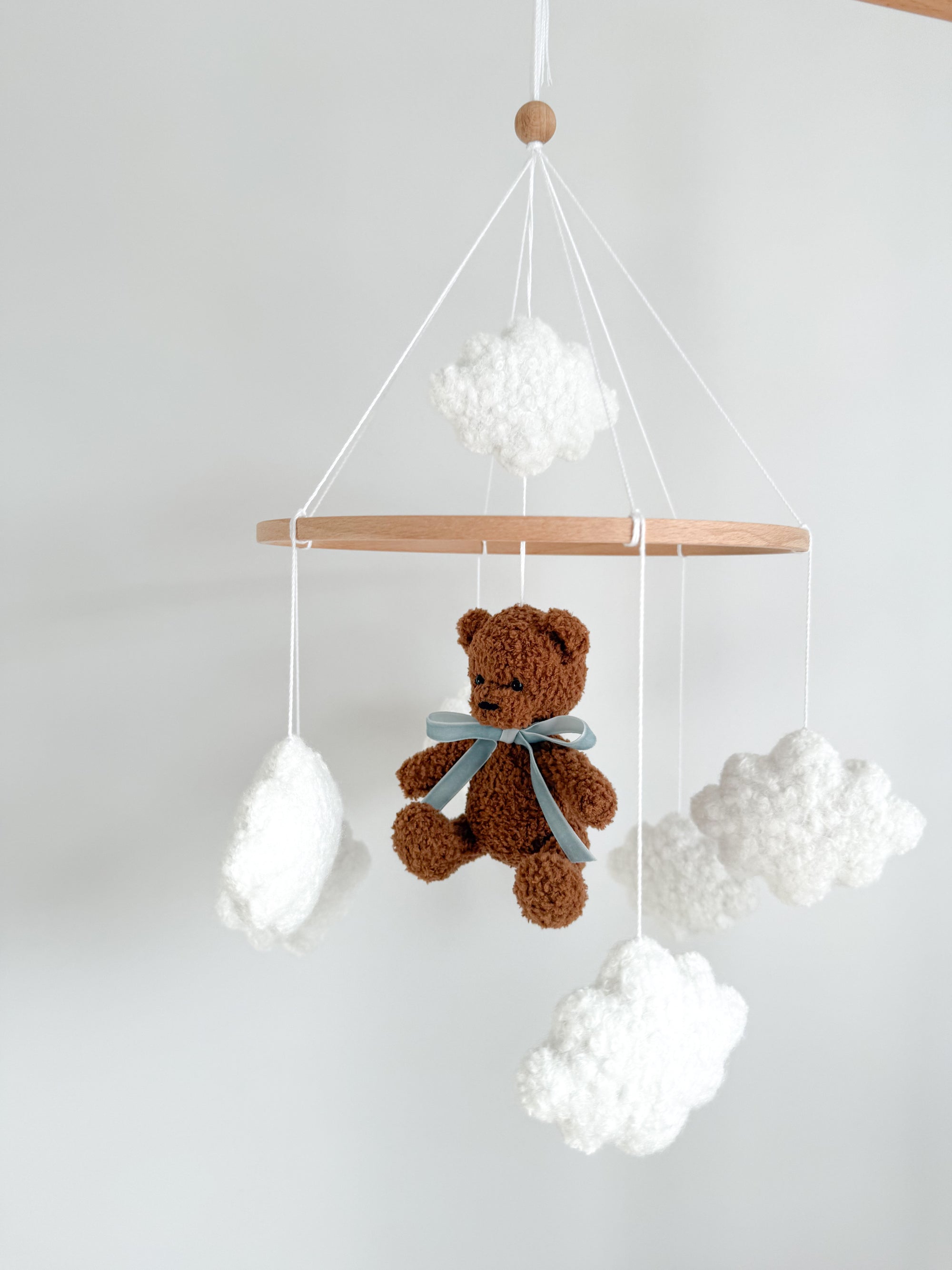 Boucle mobile with dark brown teddy bear