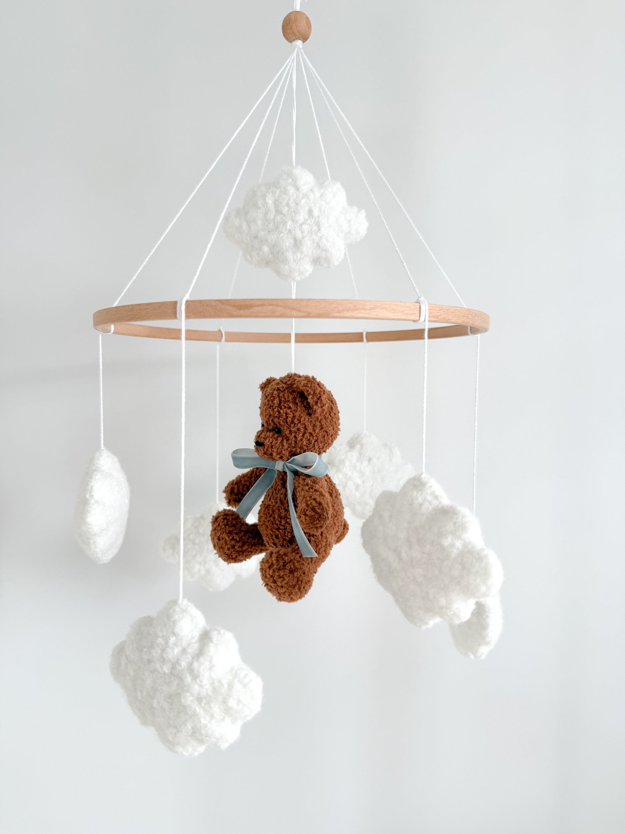 Boucle mobile with dark brown teddy bear