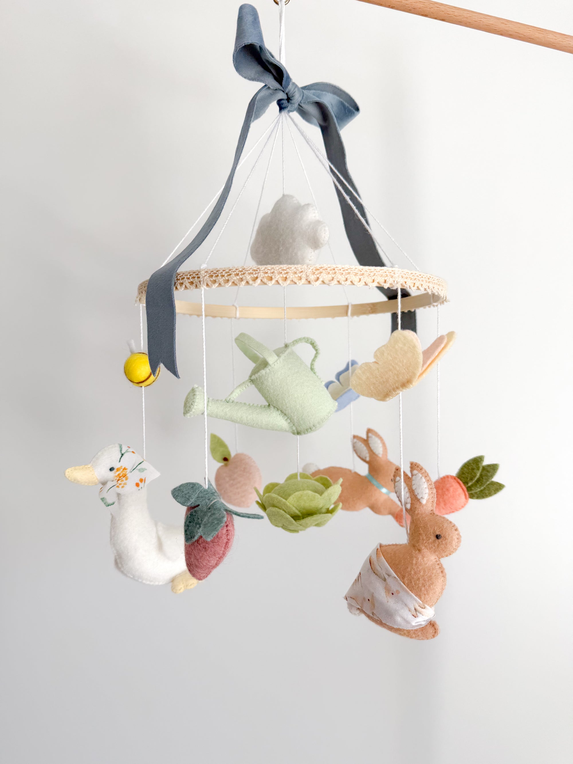 Garden rabbit mobile with blue bow
