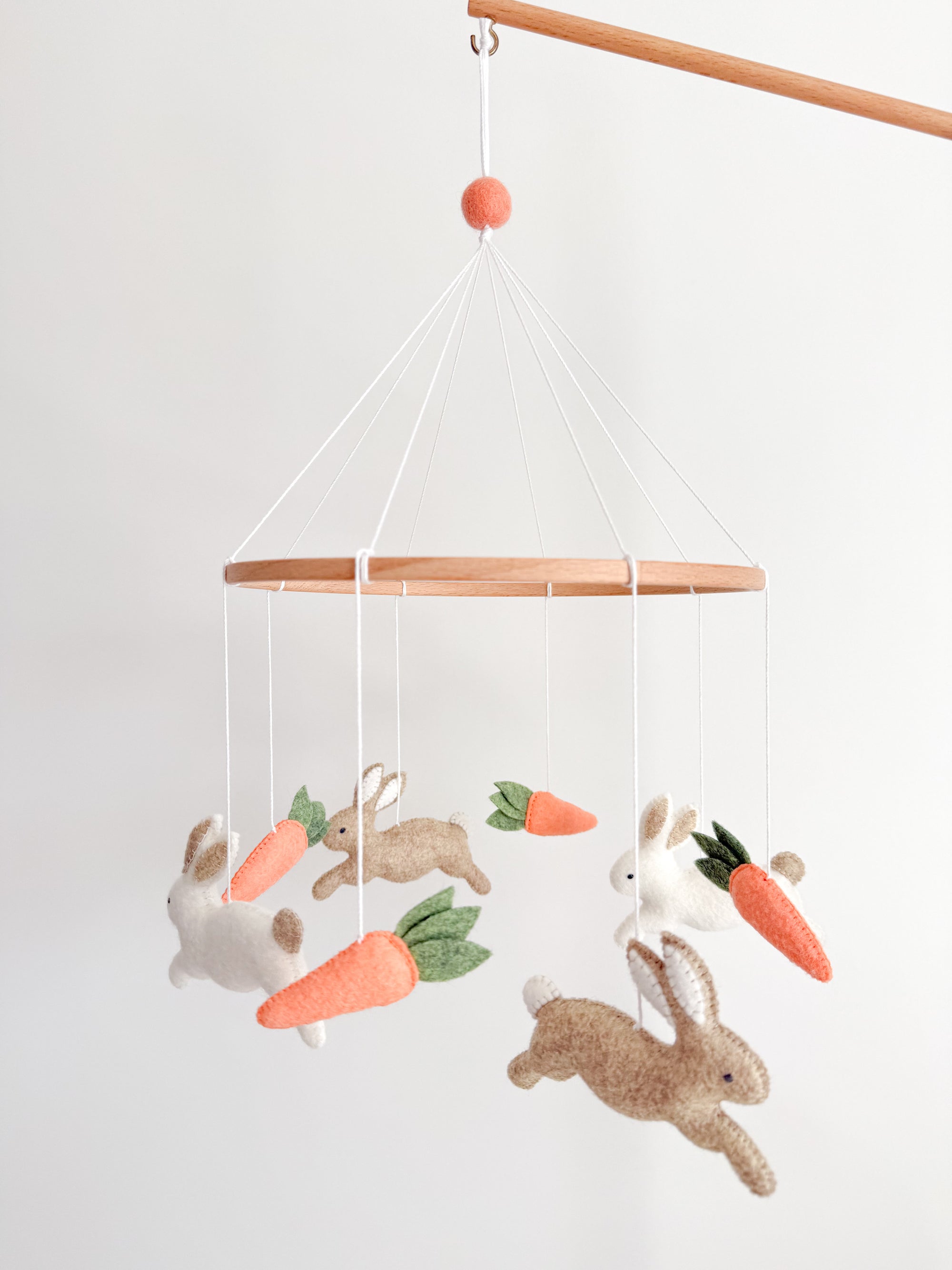 Minimalist bunny mobile with carrots