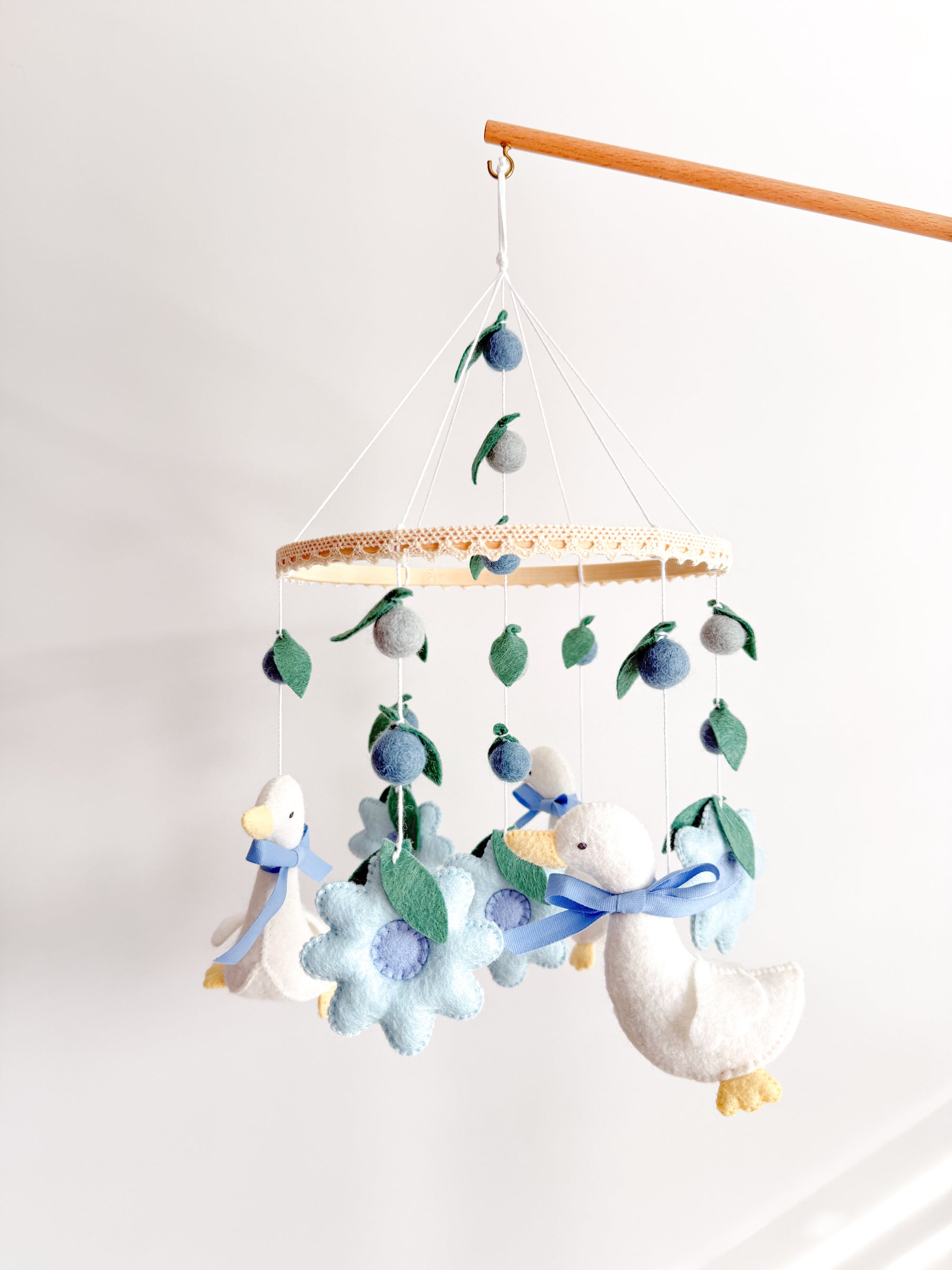 Goose mobile with blue flowers