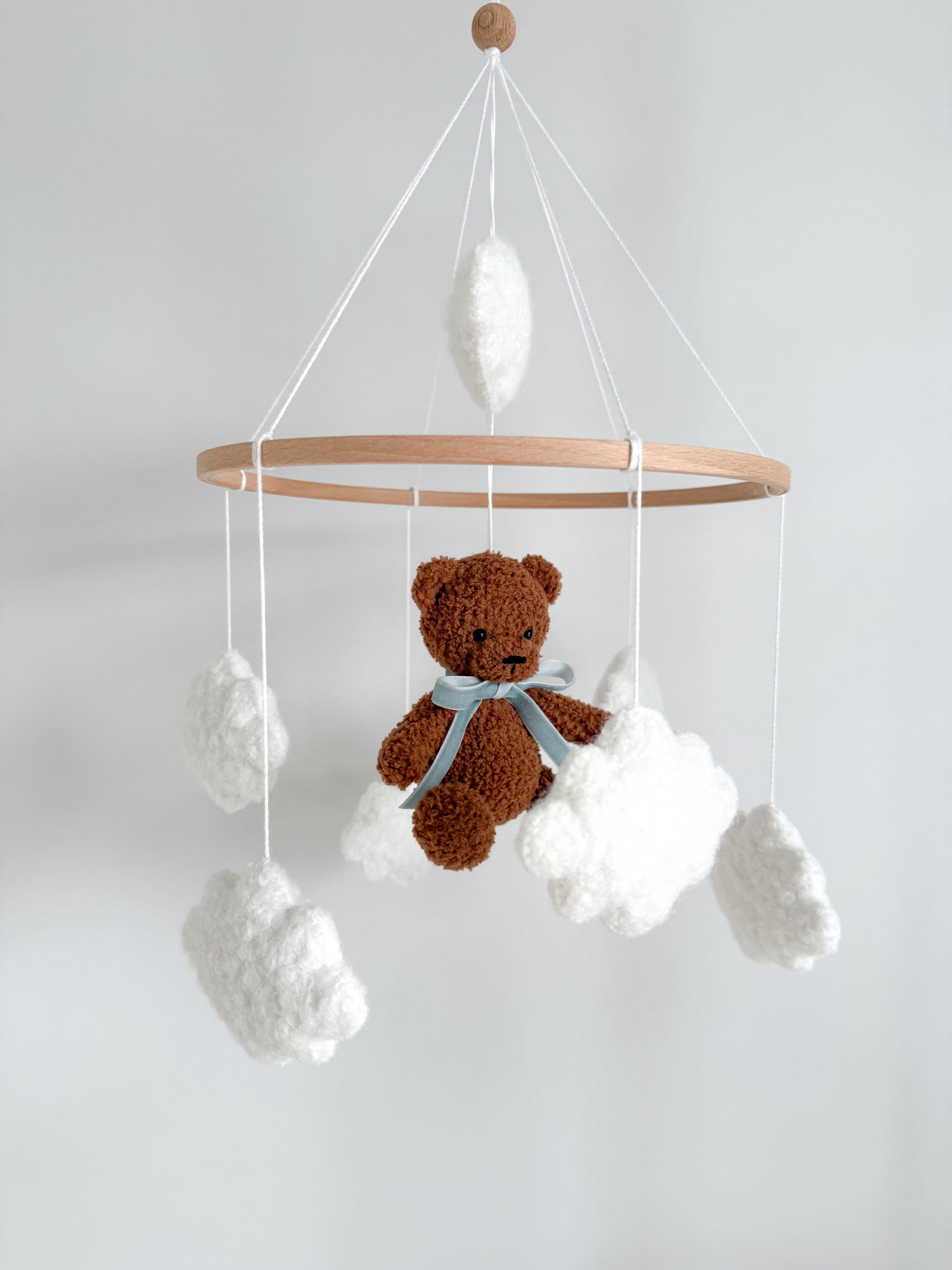 Boucle mobile with dark brown teddy bear